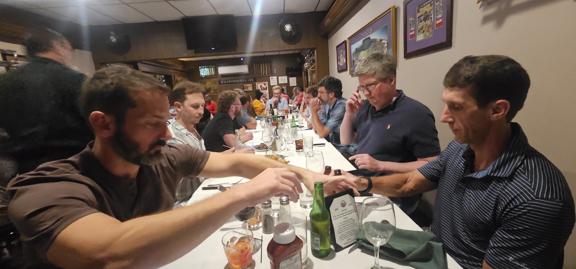 HFFL league members gathered around a long restaurant table