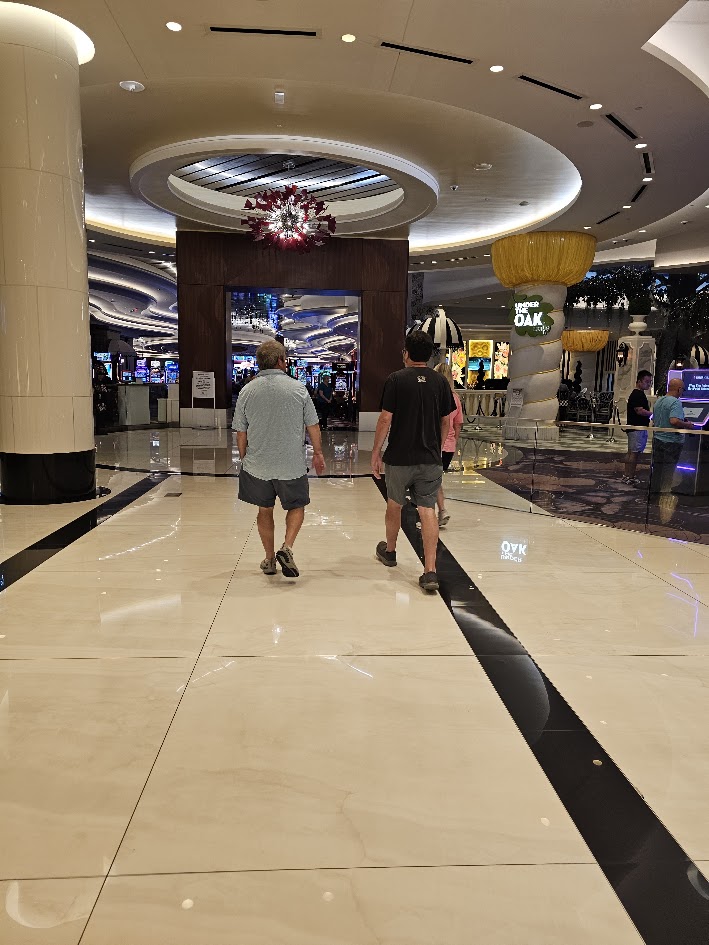 Two HFFL owners walking through a casino lobby